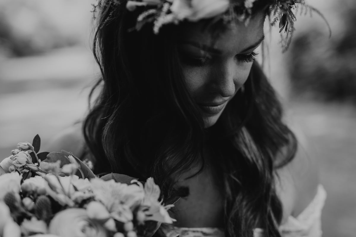 Black and white portrait of bride looking down
