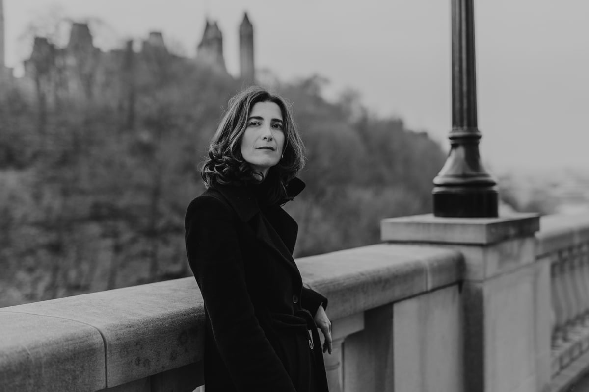 Black and white portrait of a woman standing near Parliament in Ottawa, Ontario, Canada