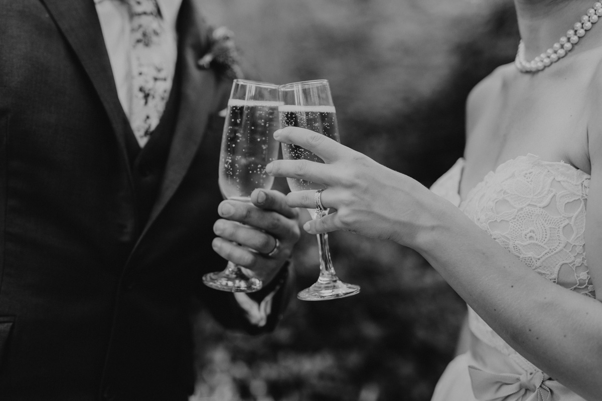 Bride and groom making a toast after their wedding ceremony
