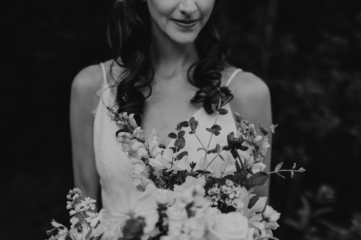 Black and white portrait of a bride holding a bouquet